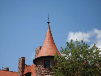 brick turret against a blue sky
